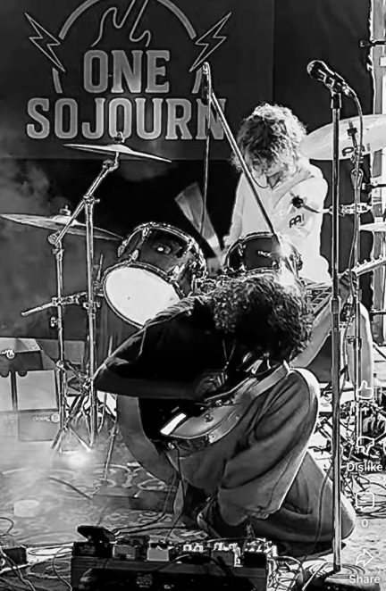 One Sojourn band members performing live